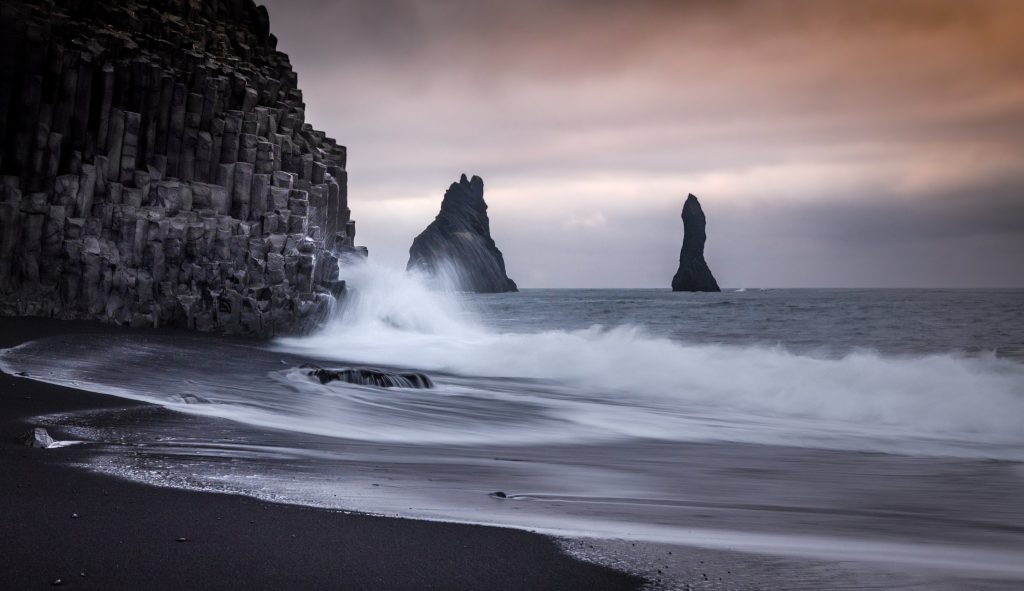 The Allure of Black Sand Beaches and Their Natural Wonders